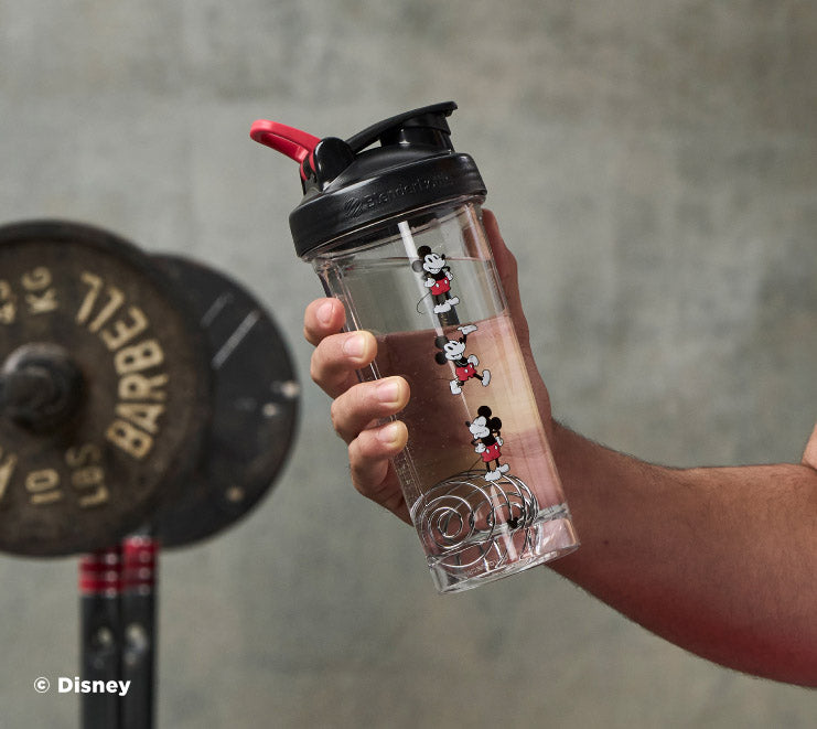 pro-series-j5 Mickey_Mouse_Protein_Shaker_Bottle_Being_Held_In_the_Gym.jpg